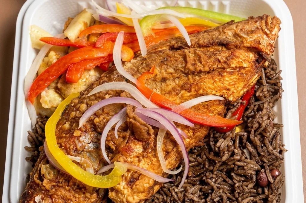 Fish (red snapper) and rice djondjon at Caribbean Latino Finger Licking Restaurant Edmonton