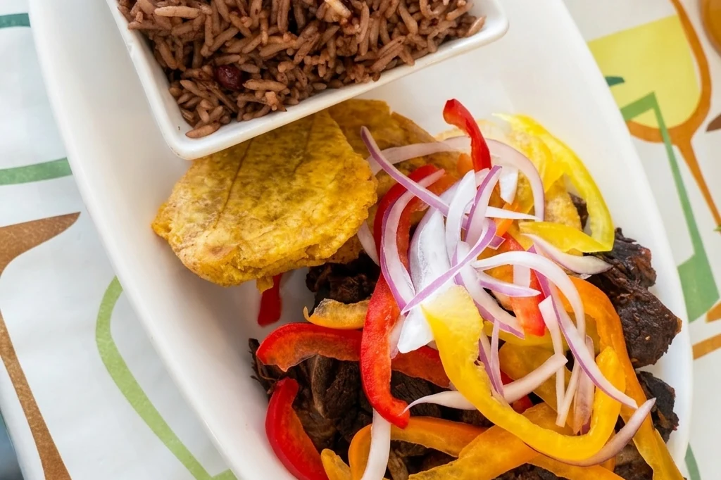 Goat and rice at Caribbean Latino Finger Licking Restaurant Edmonton